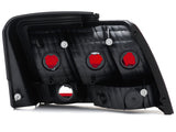 Raxiom 99-04 Ford Mustang Excluding 99-01 Cobra Tail Lights- Black Housing (Smoked Lens) 49080