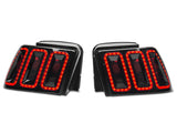 Raxiom 99-04 Ford Mustang Excluding 99-01 Cobra Icon LED Tail Lights- Black Housing (Smoked Lens) 100807