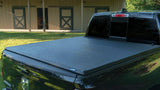 Lund 04-14 Ford F-150 (5.5ft. Bed) Genesis Tri-Fold Tonneau Cover - Black 95072