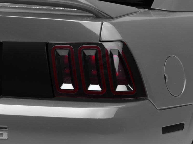 Raxiom 99-04 Ford Mustang Excluding 99-01 Cobra Icon LED Tail Lights- Black Housing (Smoked Lens) 100807